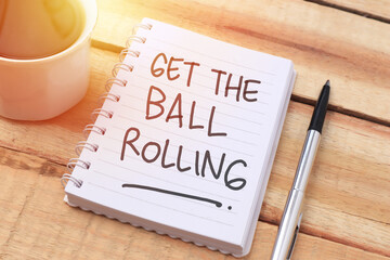 Get the ball rolling, text words typography written with paper, life and business motivational...