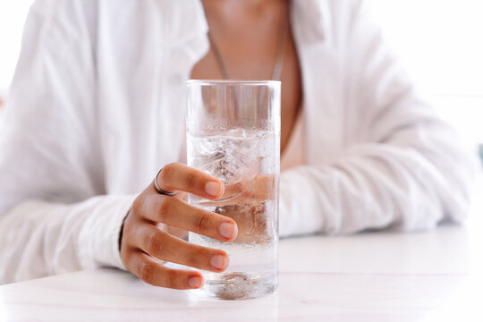 Glass of pure water in woman hand
