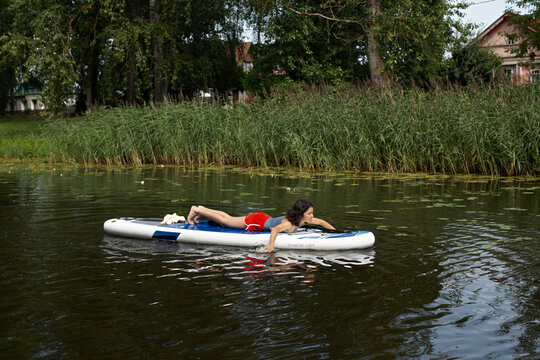Teen girl on a sup board 