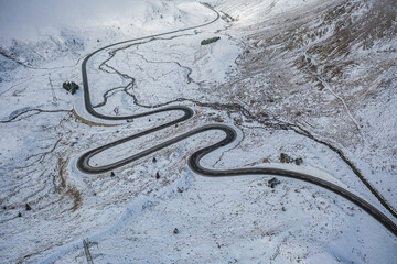 Alpine road after snow fall in early winter