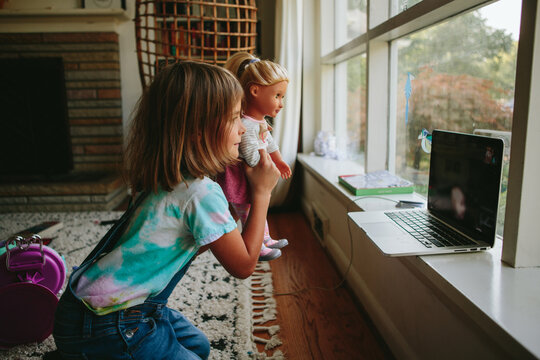 little girl has playdate over video chat