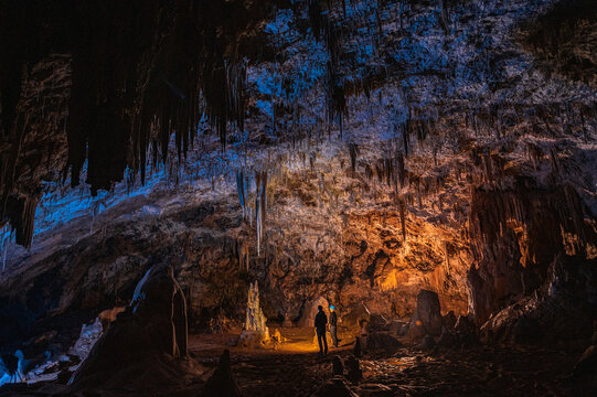 Group of cavers hiking through cave 