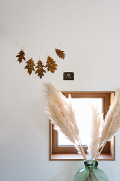 Waxed fall leaves garland with name 'cas' written on it