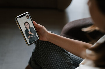 Crop woman watching online friend using sign language