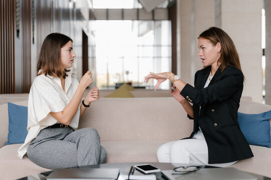 Deaf businesswomen having nonverbal conversation