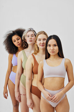 multiracial young women stand in a row