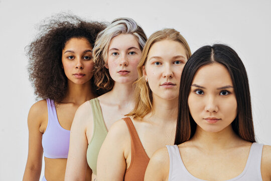 multiethnic group of women models looking at the camera
