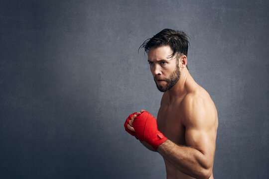 Portrait Of Exhausted Kickboxer Training
