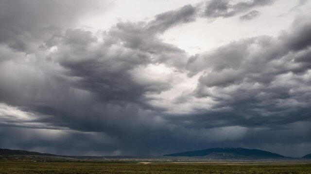 Dark low clouds moving over the Wyoming landscape in timelapse.