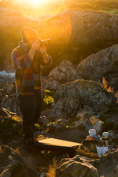 Journalist photographer taking pictures in nature 