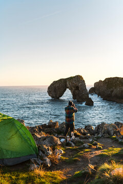 Photographer taking pictures in nature in seacliffs