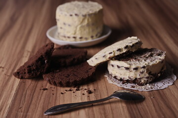 Brownie slices and buttercream cake and a teaspoon on the table.