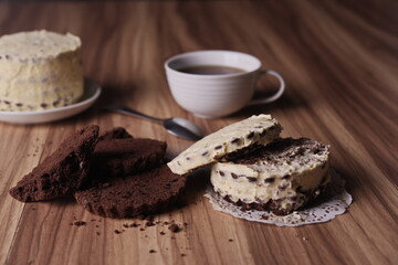 Brownie slices and buttercream cake and a teaspoon on the table.