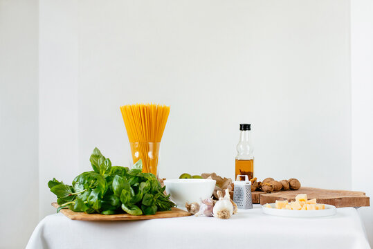 Assorted ingredients for pesto and pasta