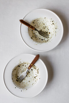 Empty bowls from pesto with forks