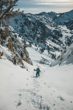 skitourer hiking in couloir