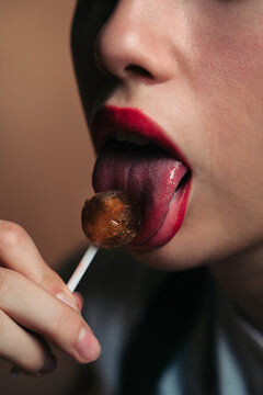 Licking a lollipop