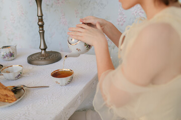 Woman pouring tea

