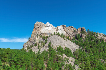 Mount Rushmore with US presidents carved portraits in summer, South Dakota, United States of...