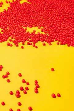 Bunch Of Red Round Shapes-Balls On Yellow Background.