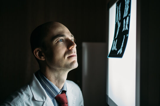 Doctor examining an X Ray