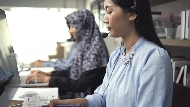 Team service operator support cilent. business call center asian team.