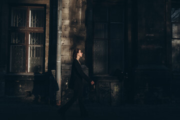 Woman walking and considering streets of foreign city 