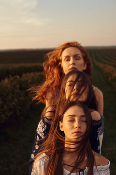 Close up in a row of faces of three different women with different types of appearance.