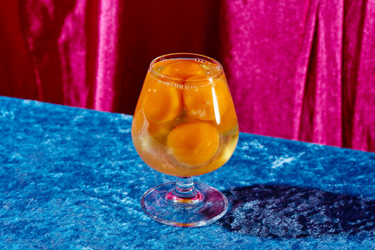 raw eggs in a brandy glass