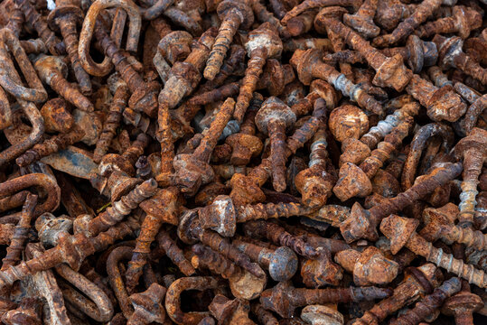Background texture of large rusty bolts stacked