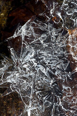 Winter ice patterns formed over Railroad Brook in Vernon, Connecticut.