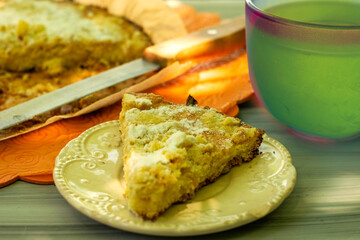 shortbread pie knife and mug of tea on the garden table on a sunny day