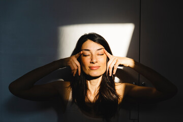 Portrait of a woman in a light window