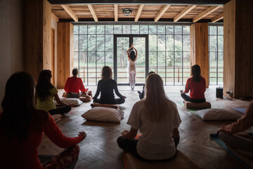 Anonymous trainer showing Mountain pose to group