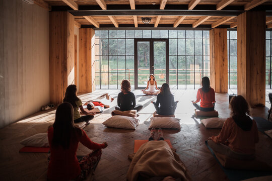 Group meditating in yoga studio