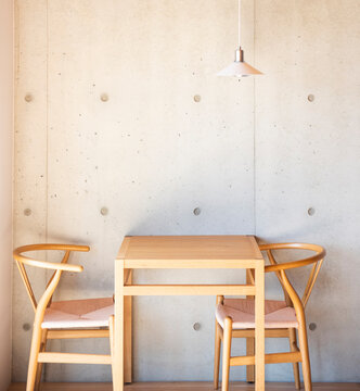 Wooden Table With Chairs And Lamp In Coffee Shop