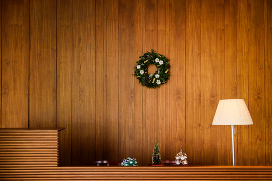 Christmas decoration and table lamp on wooden table