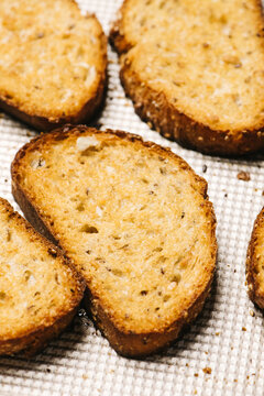Toast slices on a baking sheet