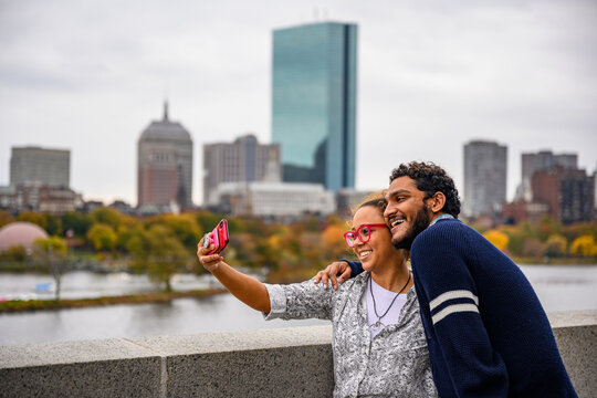 Young African American Couple Taking selfie on smartphone