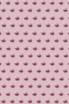 Pattern Of Pink Round Pills On Pink