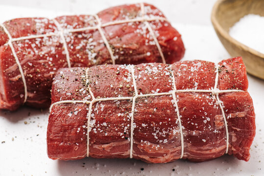 Raw and tied raw beef tenderloin