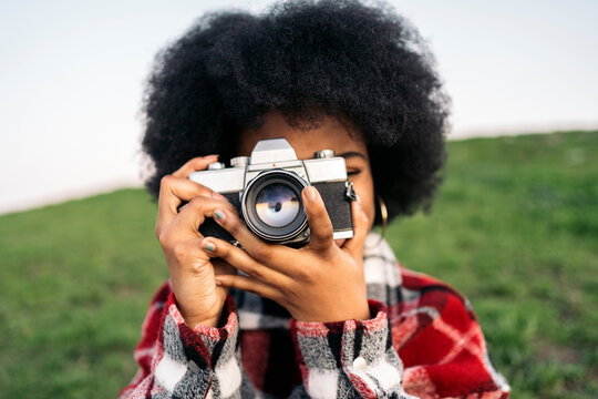Afro Girl Taking a Picture