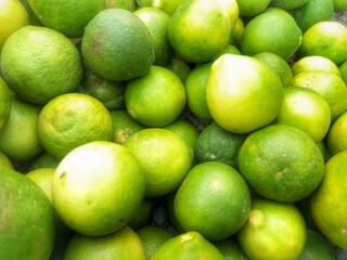 pile of limes in one of the sellers in the traditional market