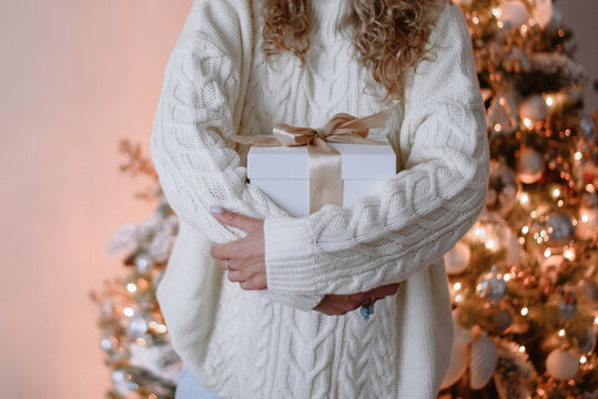 Anonymous woman holding chistmas gift