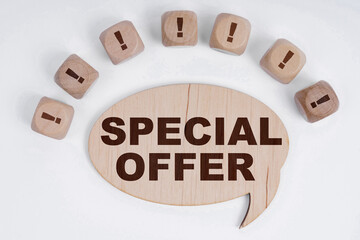 On a white background, cubes with an exclamation mark and a sign - thoughts with the inscription - SPECIAL OFFER