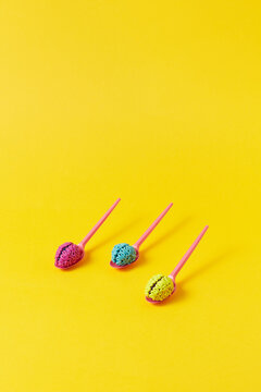 Colored brains on spoons
