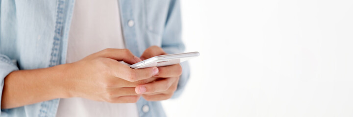 Close up of man hand holding mobile phone with copy space , People on smart phone banner, technology lifestyle