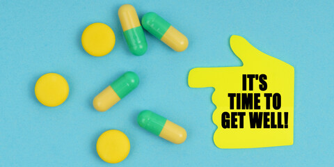 On a blue background, there are pills and a hand-sticker with the inscription - Its time to get well