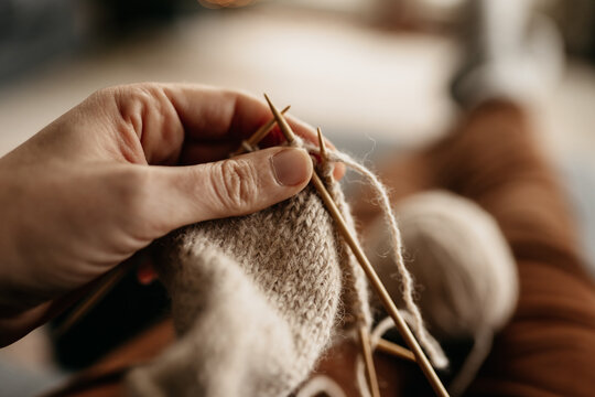 close up of woman knitting