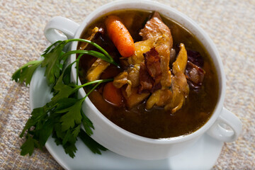Image of tasty scottish traditional soup cock-a-leekie with chicken, bacon and leek